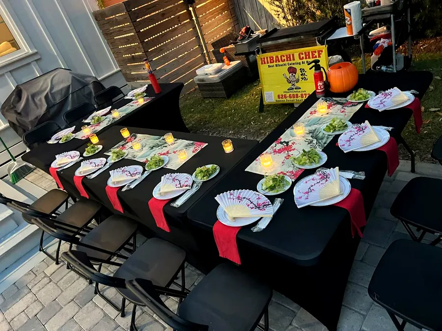 Candlelit hibachi dinner setup at home catering event